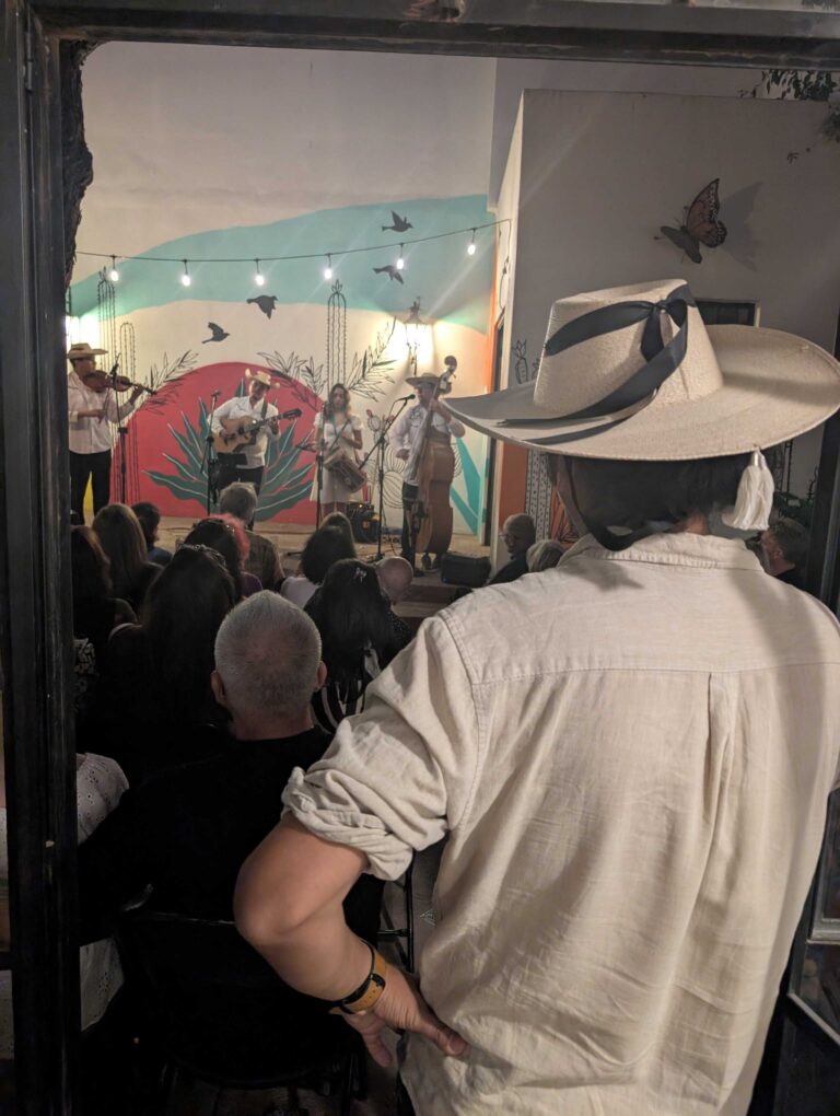 Jared Jimenez watching Conjunto La Endiablada at Conceiertos Casa Elena.